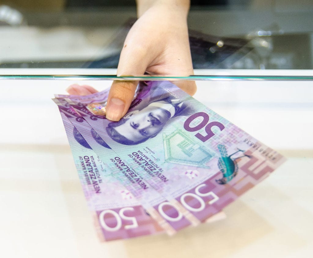 woman-holding-money-underwater