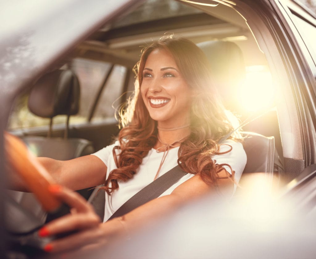 woman-driving-car-purchased-with-car-loan