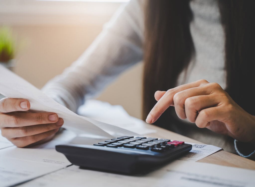 woman using calculator