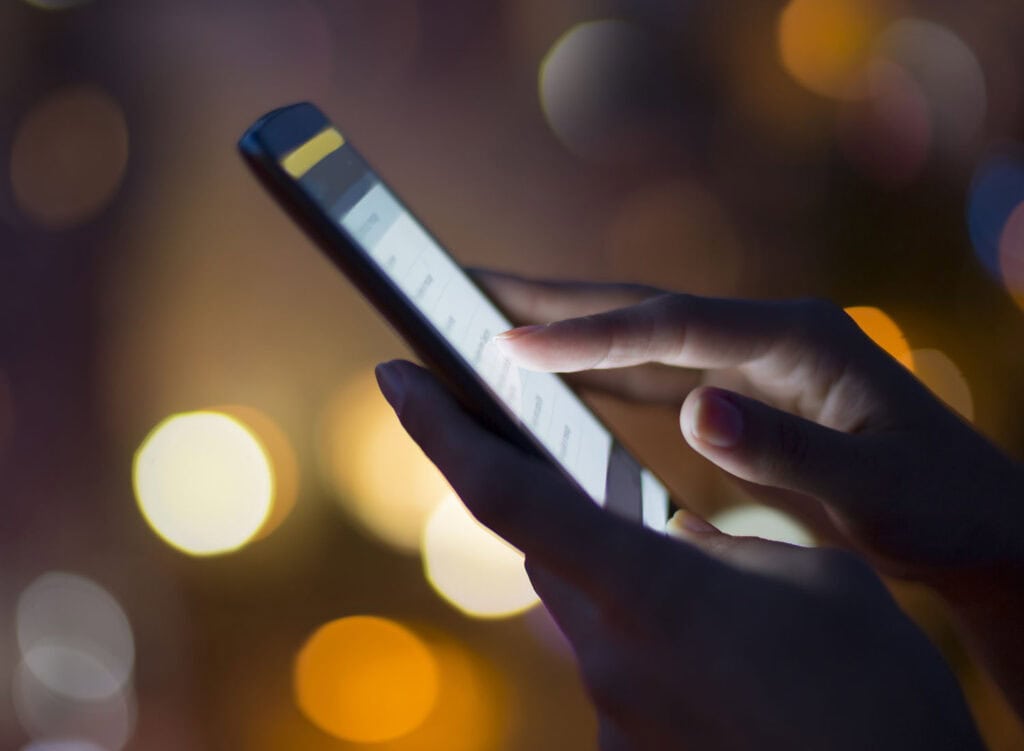 person apply for online loan on mobile phone