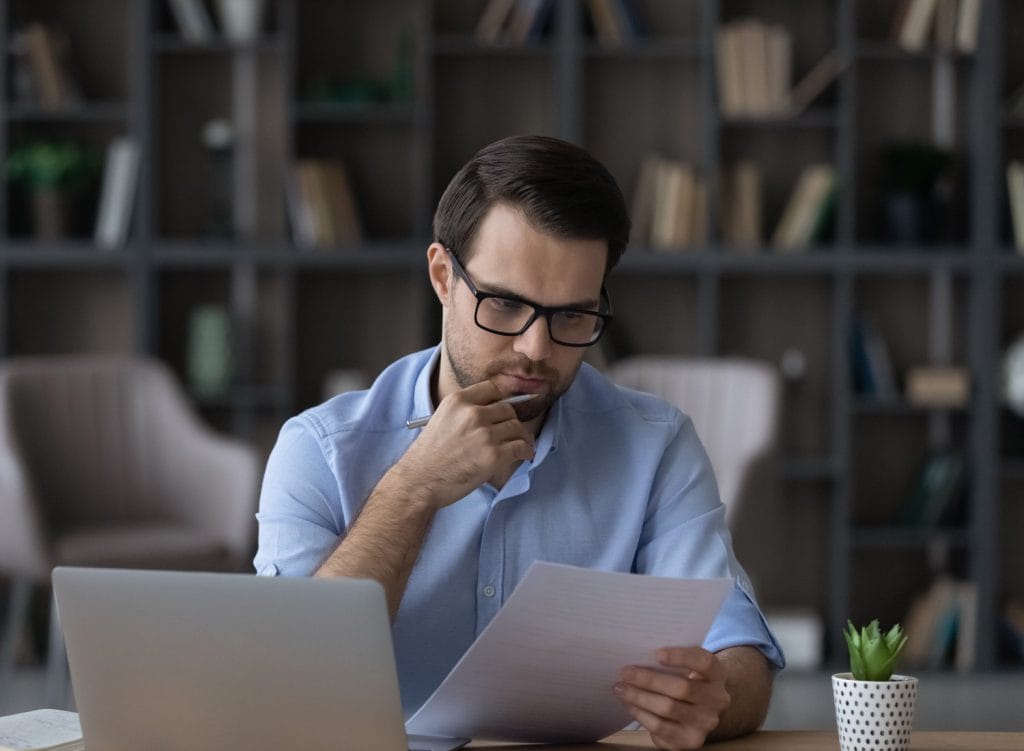 a man looking over his loan