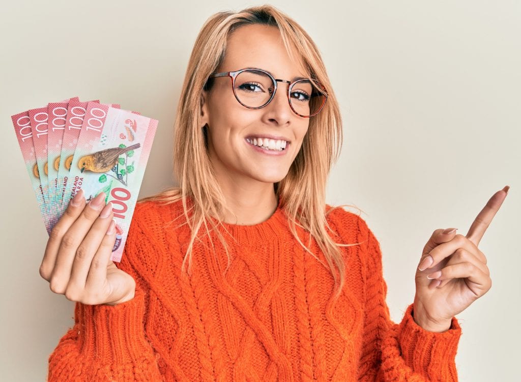 a woman showing her cash from a loan