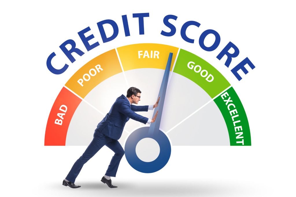 man pushing a credit score dial